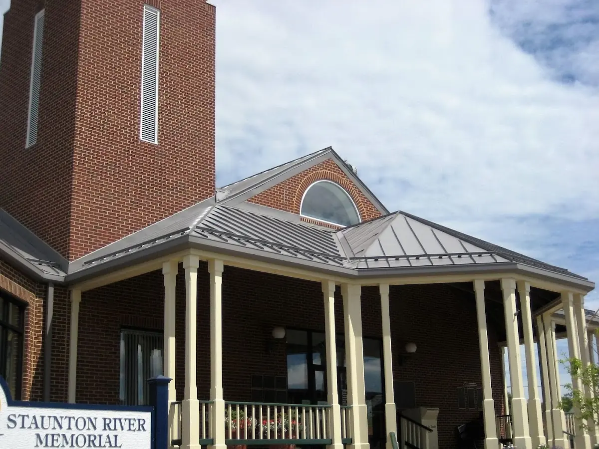 Skilled roofing craftsmen working on a residential roof in Cobleskill